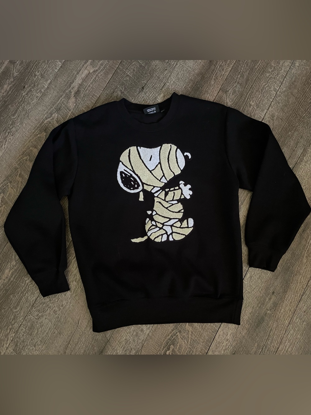 Peanuts Black Crewneck Sweater with Mummy Snoopy Graphic